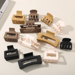 Matte finish minimalist claw clips set in earth tones with various geometric shapes