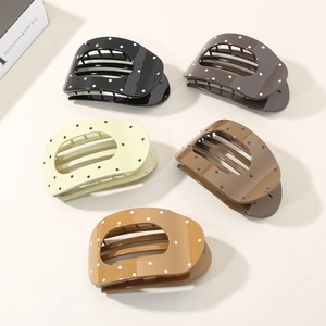 Five-piece set of wavy polka dot hair claws in earth tones for elegant hair styling
