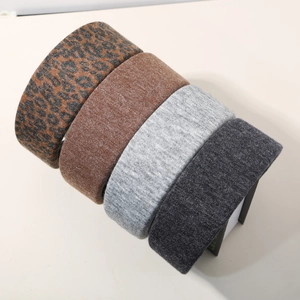 Set of four wide wool-blend headbands in leopard print and solid neutral tones for women
