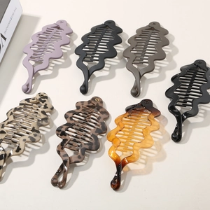 Banana hair clips set in 7 colors with wavy design and interlocking teeth for thick hair
