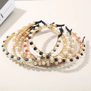 Detailed view of handmade crystal pearl beaded headbands with gold wire frame set