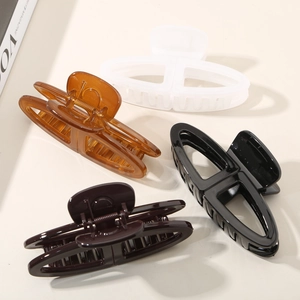 Elegant 4-piece set of large oval hair claw clips in white, amber, black, and brown