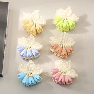 Set of six matte tulip flower hair claws in assorted macaron colors for women