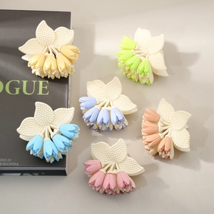 Set of six matte tulip hair claws in vibrant pastel colors with a textured resin finish