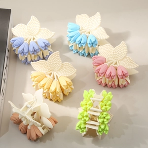 Matte tulip flower hair claw clips set in various pastel colors for elegant styling