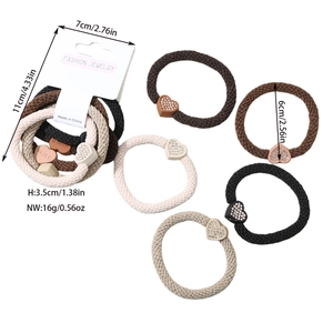 Detailed view of elastic hair ties set with rhinestone heart charms and 6cm diameter size
