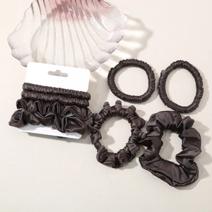 Detailed view of high-elastic silk scrunchies in coffee brown with premium satin texture