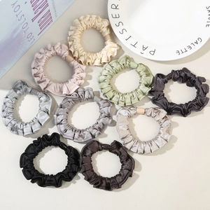 Set of ten silk-like scrunchies in Morandi colors with pleated fabric and decorative beads