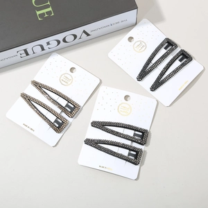 Close-up of handmade rhinestone waterdrop hair clips set on elegant display cards