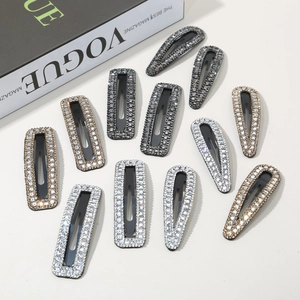 Flat lay of sparkling rhinestone BB hair clips in teardrop and rectangle shapes