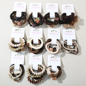 Detailed set of brown and beige elastic hair ties with pearls and handmade fabric bows