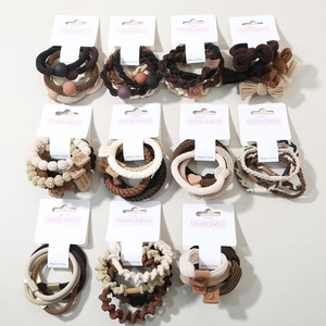 Detailed set of premium elastic hair ties with woven fabric and matte beads