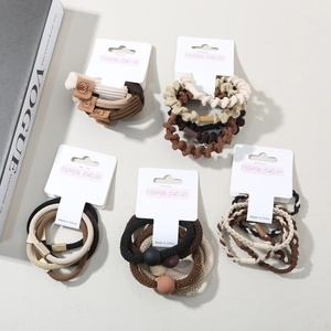 Detailed set of premium earth-tone elastic hair ties with fashion accessories and beads
