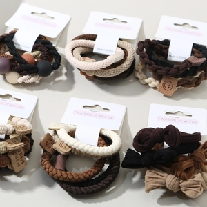 5-piece set of high elasticity hair ties in earthy tones with beads and bow accents
