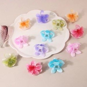Elegant frangipani flower hair claws in multiple gradient macaron colors for women