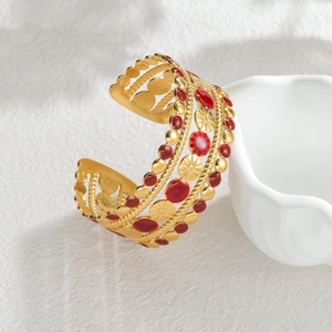 Bracciale rigido vintage francese in acciaio inossidabile dorato con smalto rosso e sole