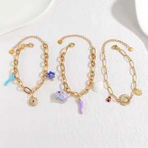 Bracelets en acier doré avec breloques d'animaux en céramique, étoile de mer et fleur