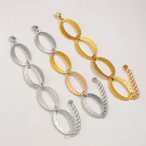 Textured stainless steel oval link bracelet in gold, silver and tri-color finishes