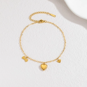 Bracelet chaîne en acier inoxydable doré avec breloques cœur, os et disque