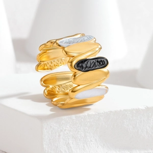 Adjustable wavy open ring with gold, silver, and black enamel layered leaf design