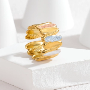 Adjustable wide band ring with three-tone gold plating and textured wavy leaf patterns