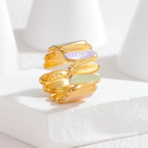 Detailed view of irregular wave open ring with colorful enamel inlay on gold base