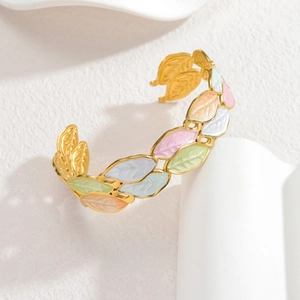 Adjustable gold open bangle with colorful enamel leaf motifs in macaron shades