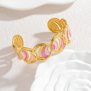Elegant gold hollow geometric enamel cuff bracelet with pink and white accents