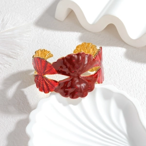 Golden stainless steel open bangle featuring red dripping oil mask and shell design