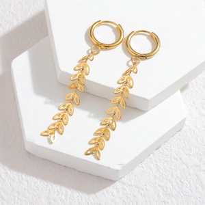 Elegant 18k gold plated wheat tassel hoop earrings for women on white marble stand