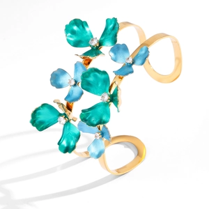 Elegant gold-plated open bangle featuring vibrant enamel flowers with crystal centers