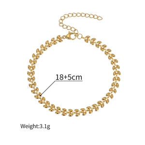Detailed view of golden leaf chain bracelet with lobster clasp and extension chain