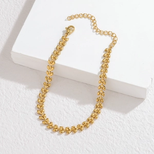 Detail of golden wheat-patterned stainless steel necklace with lobster clasp