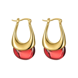 Vintage gold U-shaped earrings with red teardrop resin pendants on white background
