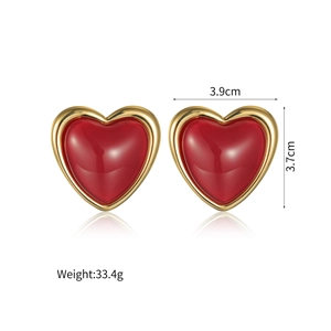 Macro view of vintage red heart earrings showing 3.9cm width and 3.7cm height measurements