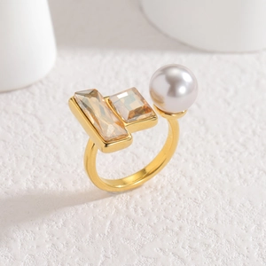 Vintage gold ring with geometric champagne zircon and white pearl on white stone