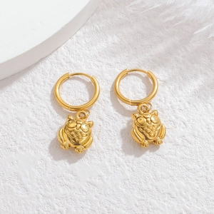 Exquisite gold-plated owl drop earrings featuring textured metal details on a white background