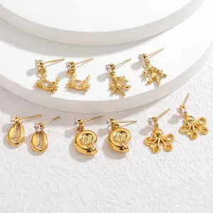 Golden stainless steel ocean theme earrings set with crab shell octopus and zircon
