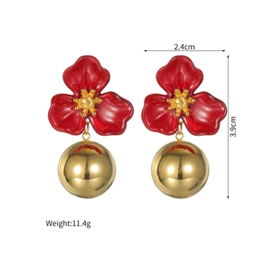 Detail view of red flower earrings with gold ball drop and measurements text