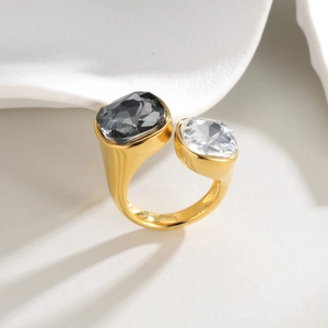 Adjustable gold plated open ring with contrasting clear and smoke grey square zircon stones