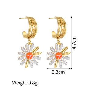 Detail view of daisy earrings showing dimensions 4.7cm by 2.3cm and gold layered loops
