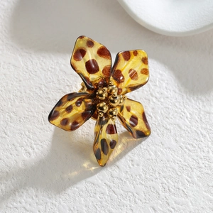 Elegant leopard print resin flower ring with golden metallic center beads and open design