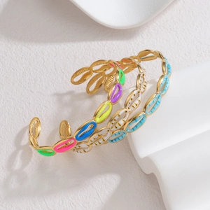 Polished gold cuff bracelets with colorful enamel shell design for a vibrant look
