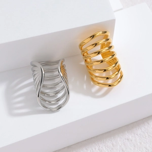 Minimalist multi-layered spiral ear cuff in polished gold and silver finishes