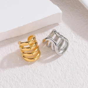Minimalist multi-layer hollow line ear cuffs in gold and silver finish on white stone
