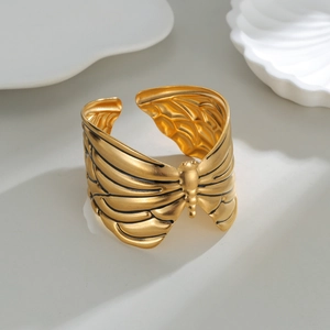 Vintage gold butterfly texture open bangle in stainless steel with a matte finish