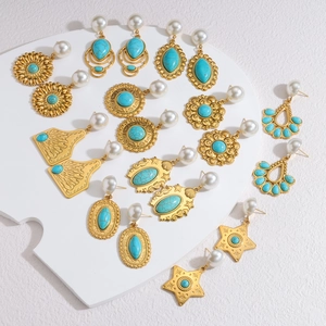 Vintage gold earrings set with turquoise stones and white pearls in various shapes