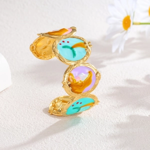 Vintage gold-plated oval bangle with colorful enamel circles and artistic wavy patterns