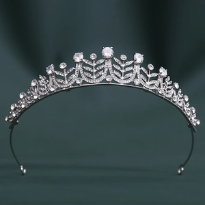 Macro shot of silver bridal crown with symmetrical leaves and sparkling 3A zircon stones