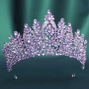 Detailed close-up of Baroque silver crown with intricate purple zircon crystals